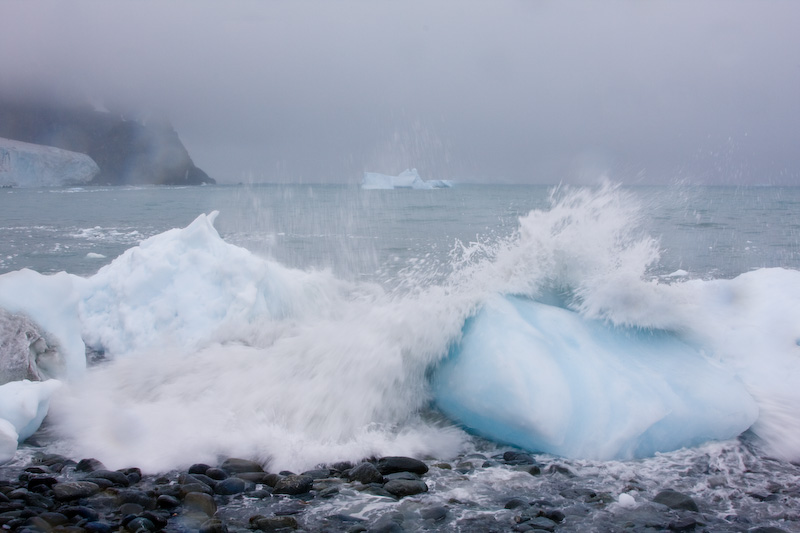 Waves Breaking Over Grounded Icebergs